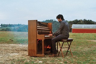 André Costello burns a piano