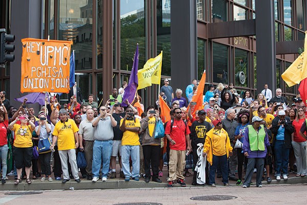 Hundreds of demonstrators gather at a rally outside UPMC's Downtown headquarters July 30.