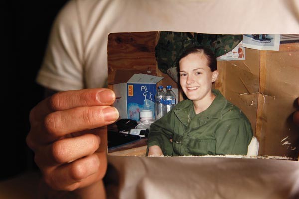 Joyce Wagner, with a photo of herself serving in Iraq
