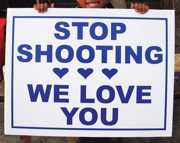 One of Vanessa German's "Stop Shooting We Love You" signs
