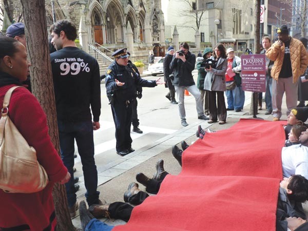 Protesters stage a "red-carpet protest" for Gov. Tom Corbett on Feb. 17.