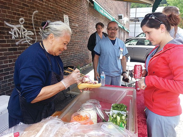 Street-food vendor Lucy Nguyen sells banh mi.