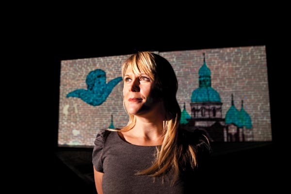 Tami Dixon in rehearsal at City Theatre for South Side Stories, with a projection by artist David Pohl