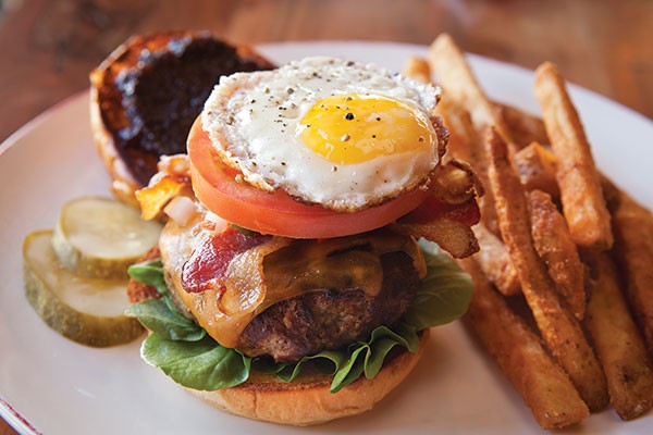 Ten Penny Burger, with watercress, red-onion jam, bacon and a sunny-side-up egg