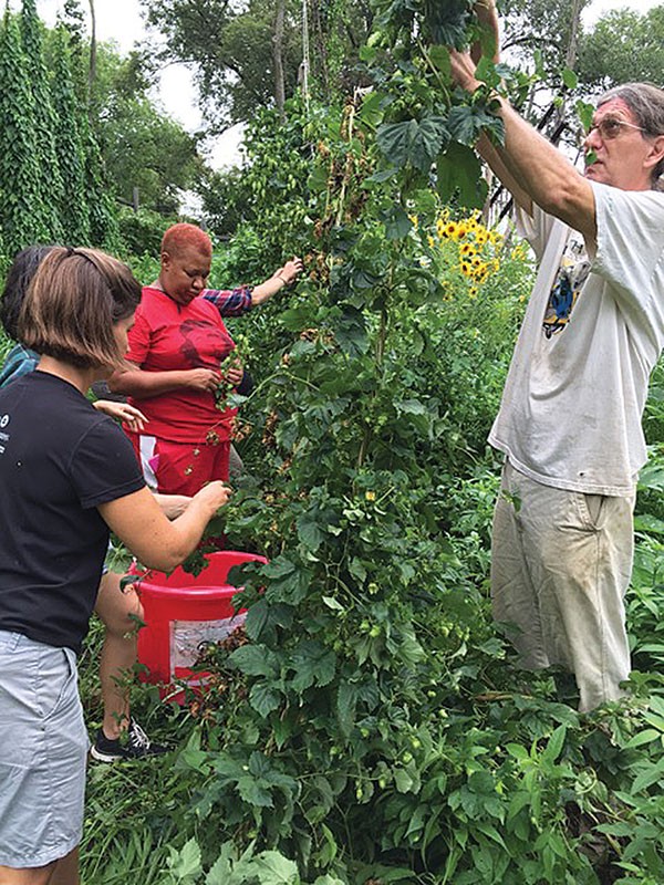 Darrell Frey (at right) and volunteers at Garfield Community Farm