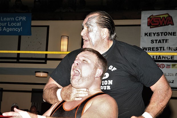 Bill Eadie, who will wrestle his final singles match on July 22, chokes Shawn Blanchard at a 2016 Keystone State Wrestling Alliance event.