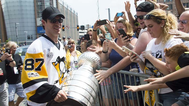 Pittsburgh Penguins fans cram into Downtown for the city's Stanley Cup victory parade