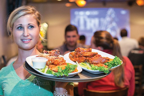 Comin' in hot: Bigham waitress Nikki Rockey, with a fresh plate of wings