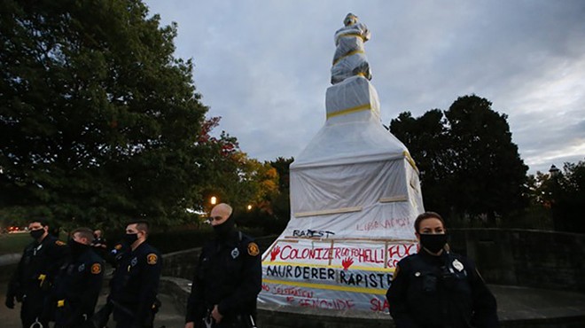 Police surround a vandalized Christopher Columbus statue in Pittsburgh