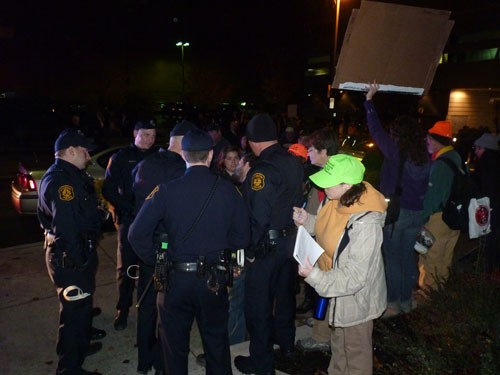 Occupiers face off with cops, Halliburton