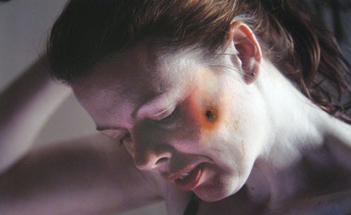 A show of manipulated photos explores the toll of domestic abuse.
