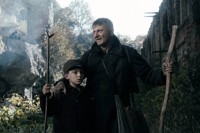 A man and a young boy hold walking sticks in the Ukrainian film The Guide.