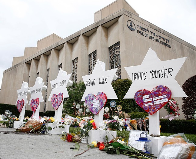 Star of David memorials with the names of the 11 people who were killed at Tree of Life Synagogue, shown outside the Squirrel Hill synagogue