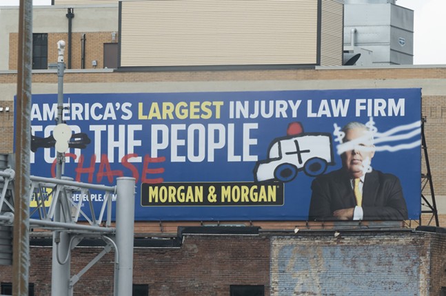 The real reason a law firm decided to vandalize its own billboards