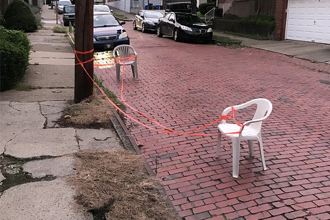 A parking chair on a brick road that has nothing to do with Palestine but does capture the forlorn vibe of trying to write about parking chairs while thinking about a horrific, intractable war.