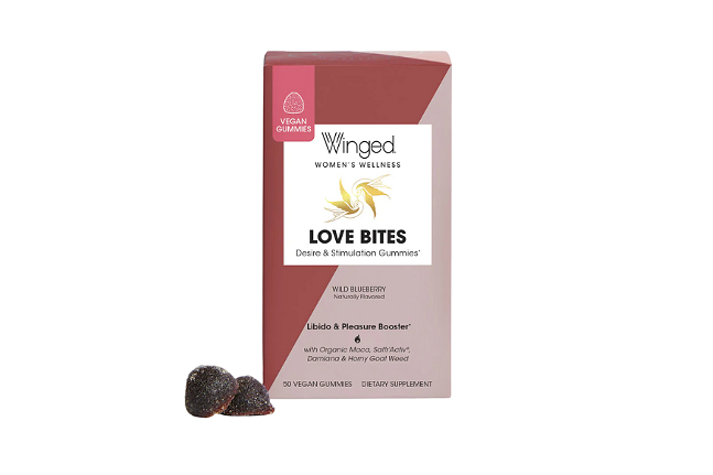 Small lavender and raspberry colored package with text that reads: "Winged Women's Wellness love bites desire & stimulation gummies wild raspberry naturally flavored." White background, two dark purple-ish/red-ish gummies in the foreground.