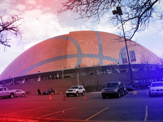 A large domed arena overlaid with a subtle basketball graphic and red and blue colors.