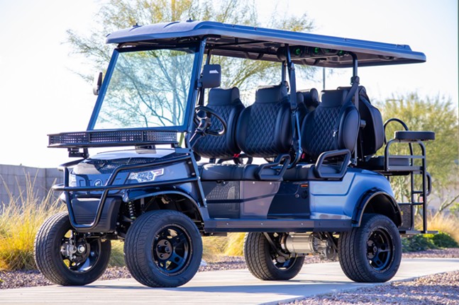 A glossy black golf cart with racing-style seating and luggage racks