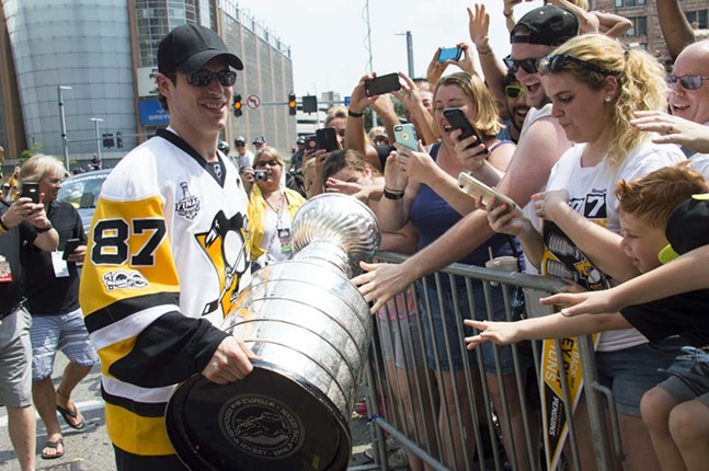 Pittsburgh Penguins fans cram into Downtown for the city's Stanley Cup victory parade