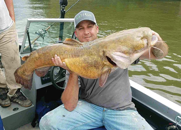 Joe Granata with a flathead catfish he caught earlier this year in the Ohio River