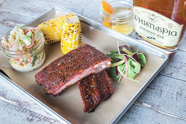 Smoked ribs with napa cabbage slaw, corn on the cob and mixed-vegetable salad