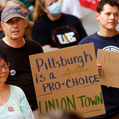 Crowd of protesters holding signs including "Pittsburgh is a pro-choice union town" and "pro-choice pro-union"