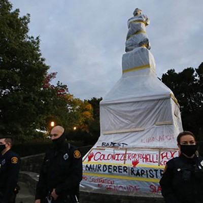 Police surround a vandalized Christopher Columbus statue in Pittsburgh